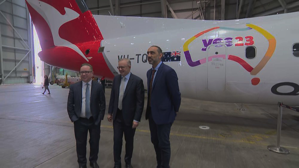 Albanese and Joyce smiling in front of QANTAS Yes Voice aircraft in 2023 referendum